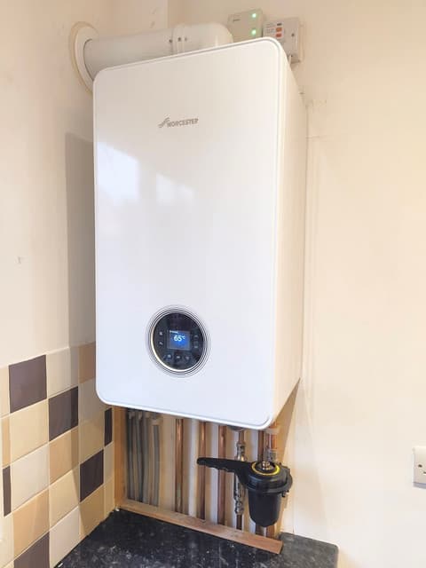 Engineer completing a boiler installation