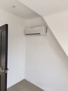 Outdoor air conditioning unit on a wall bracket